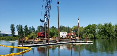 Setting piles for the short term tie up dock.